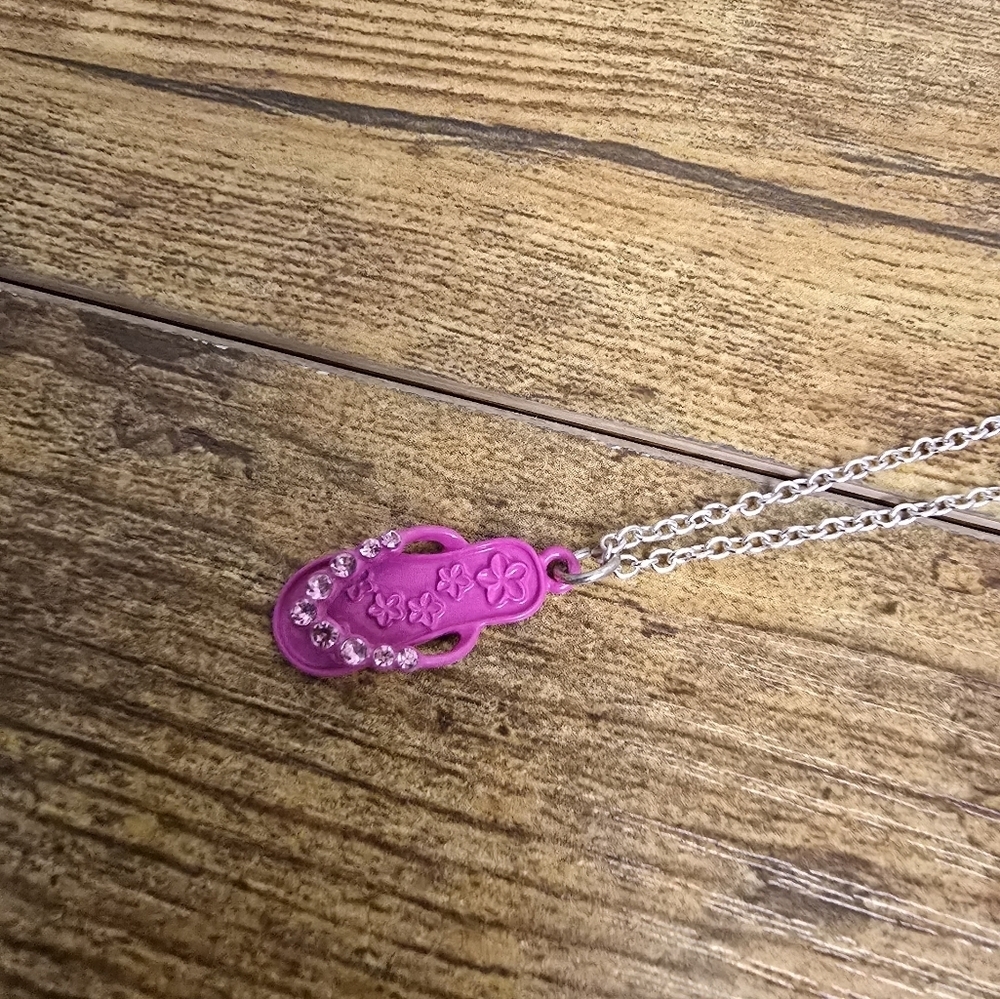Silver tone necklace with pink sandle pendant